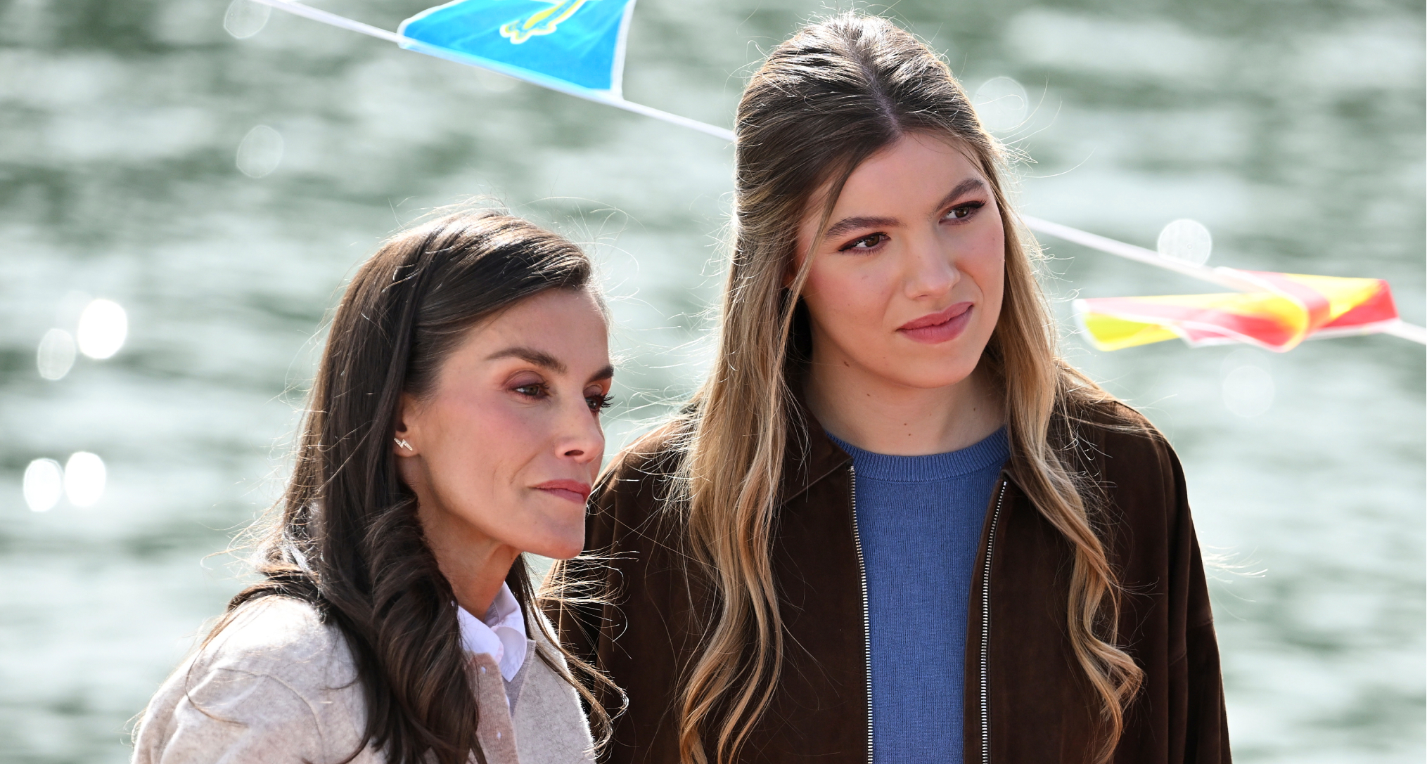 Queen Letizia and Infanta Sofia standing on a boat