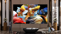 An LG display showcasing fish in bright, vivid colors in a hotel lobby.