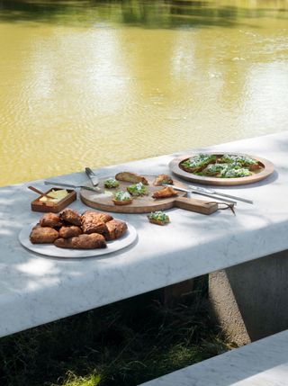 John Pawson Home Farm Cooking Spring recipes laid on white marble table in the garden
