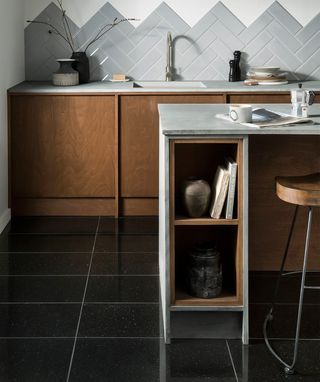 Black granite flooring in a kitchen