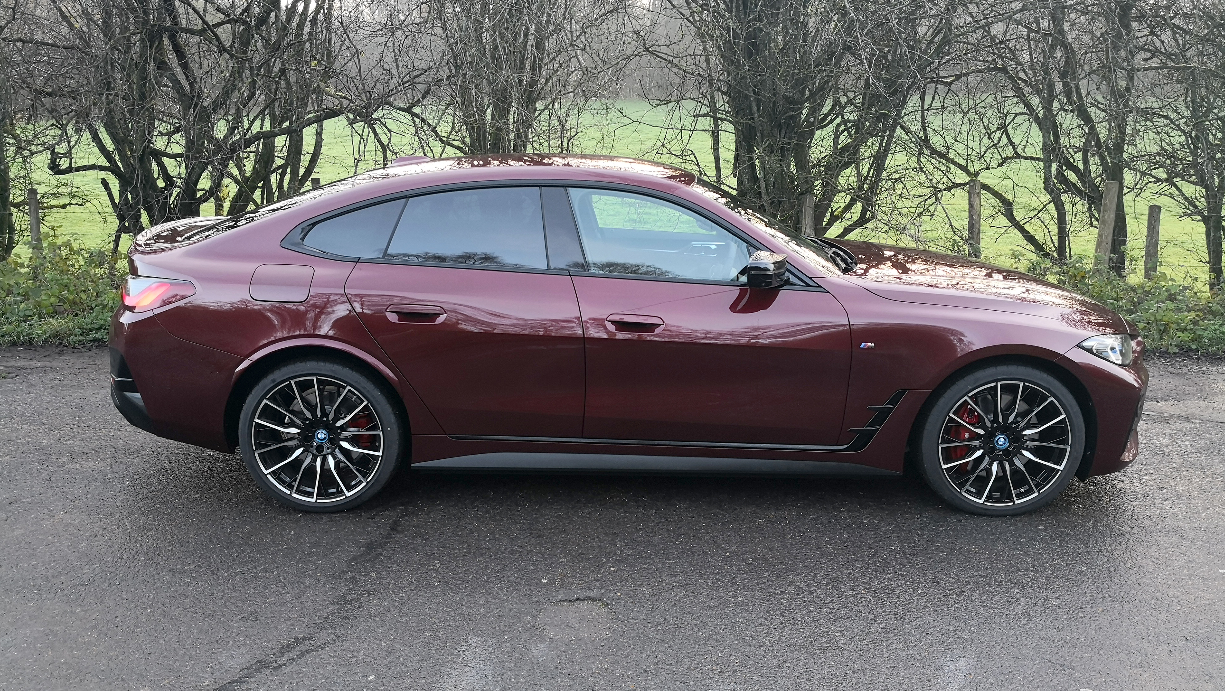 bmw i4 in red side view