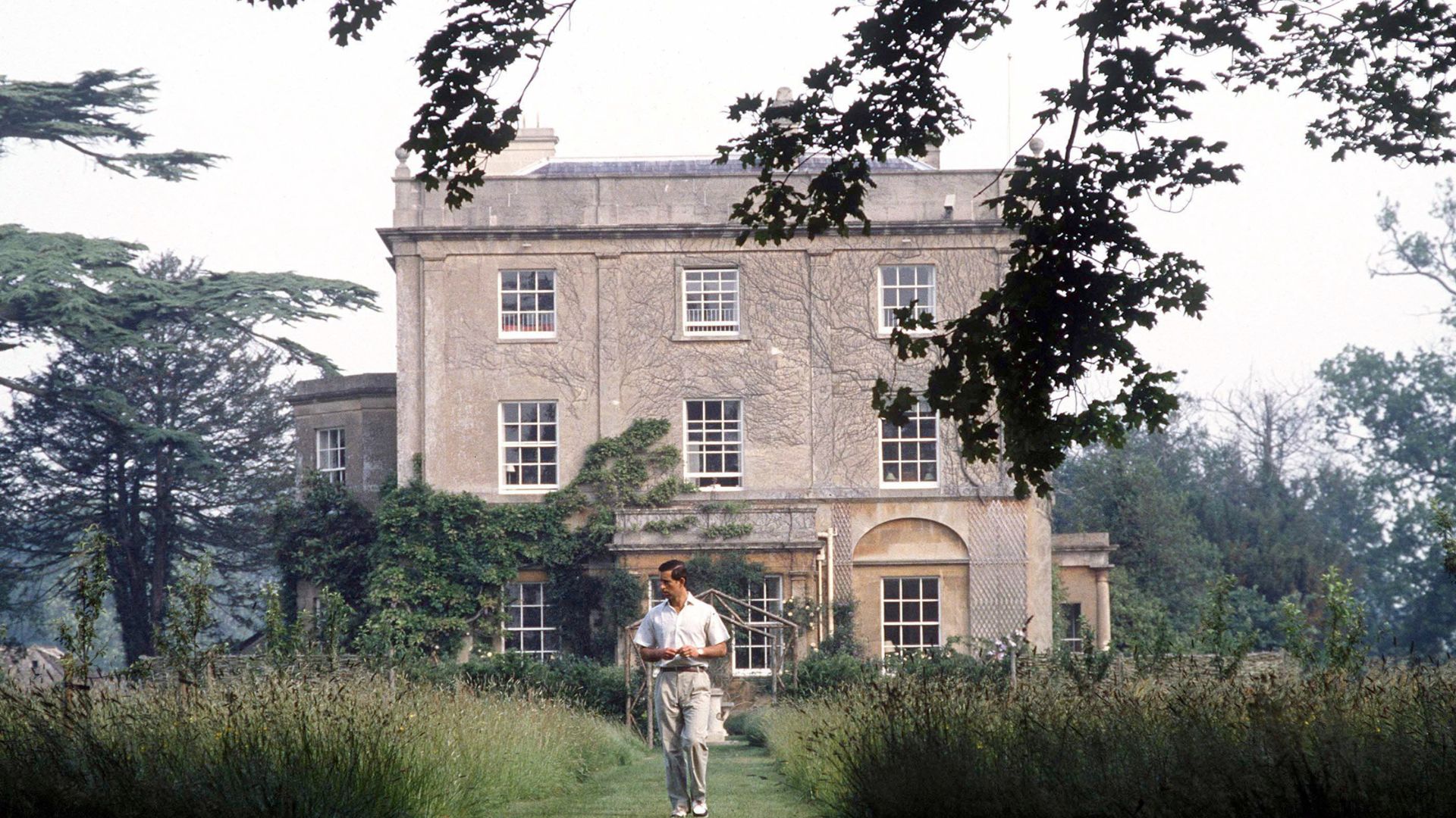 King Charles walking around Highgrove House and gardens