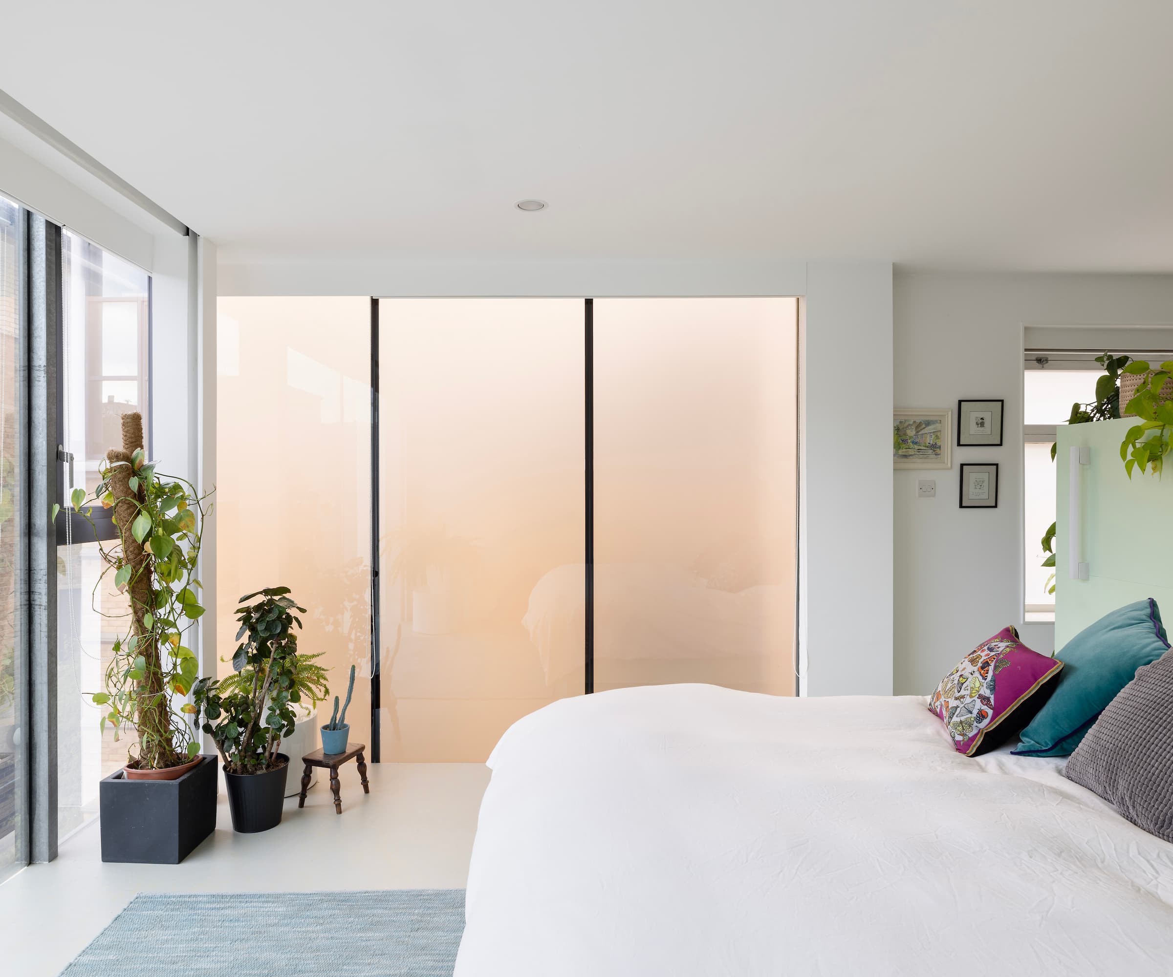 A white bed with frosted, sandblasted glass