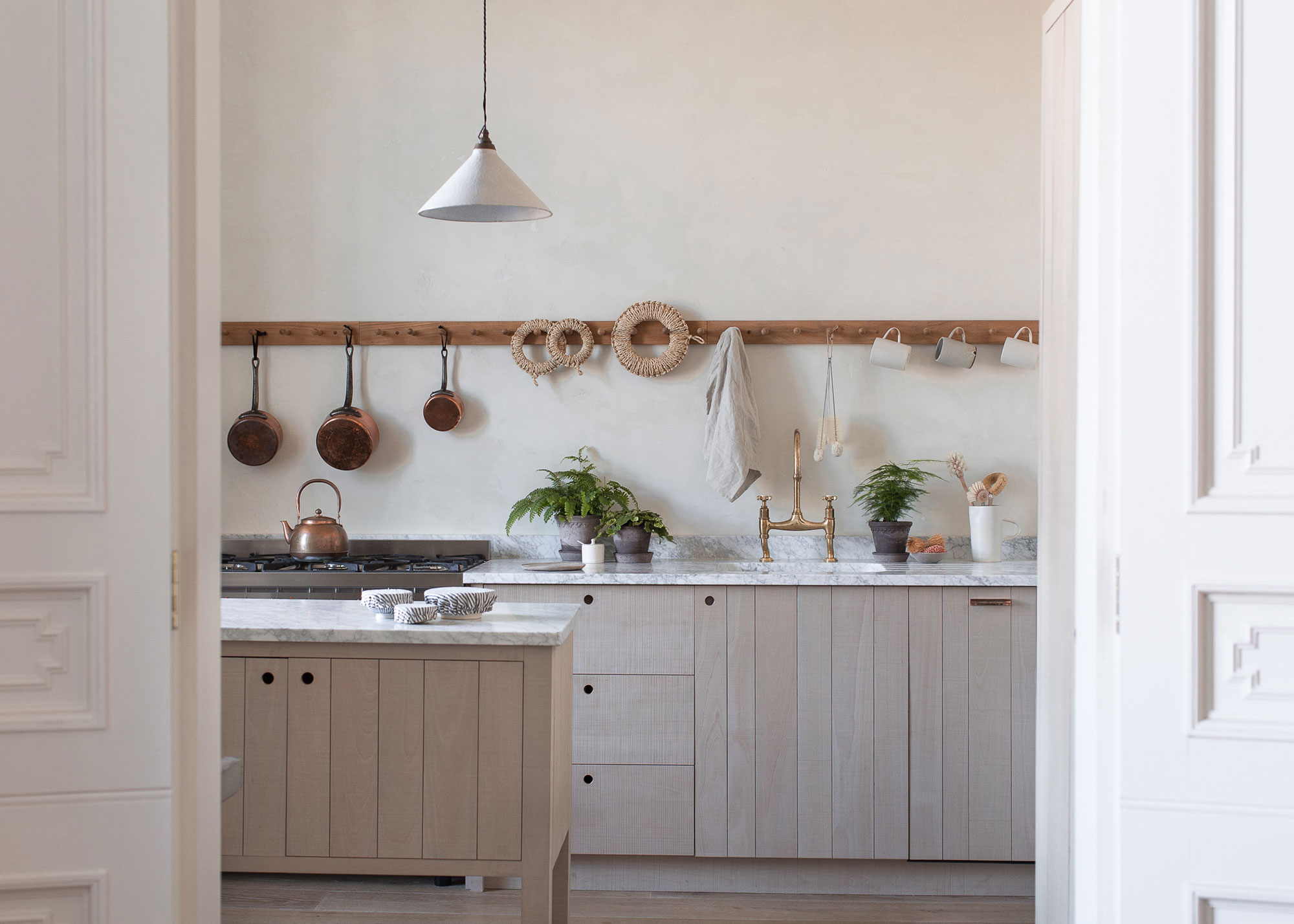rustic wooden kitchen with hanging peg rail