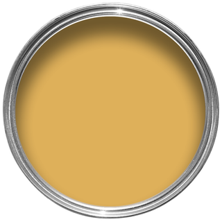 Open tin of Dulux paint in the shade Honey Mustard