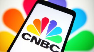 In this photo illustration, CNBC (Consumer News and Business Channel) logo is seen on a smartphone screen.