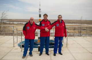 Expedition 43 Crew Members Join Hands