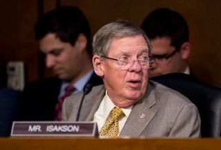 Sen. Johnny Isakson, R-Ga., looks on during the mark up of the Senate's tax reform bill in the Senate Finance Committee on Thursday, Nov. 16, 2017.