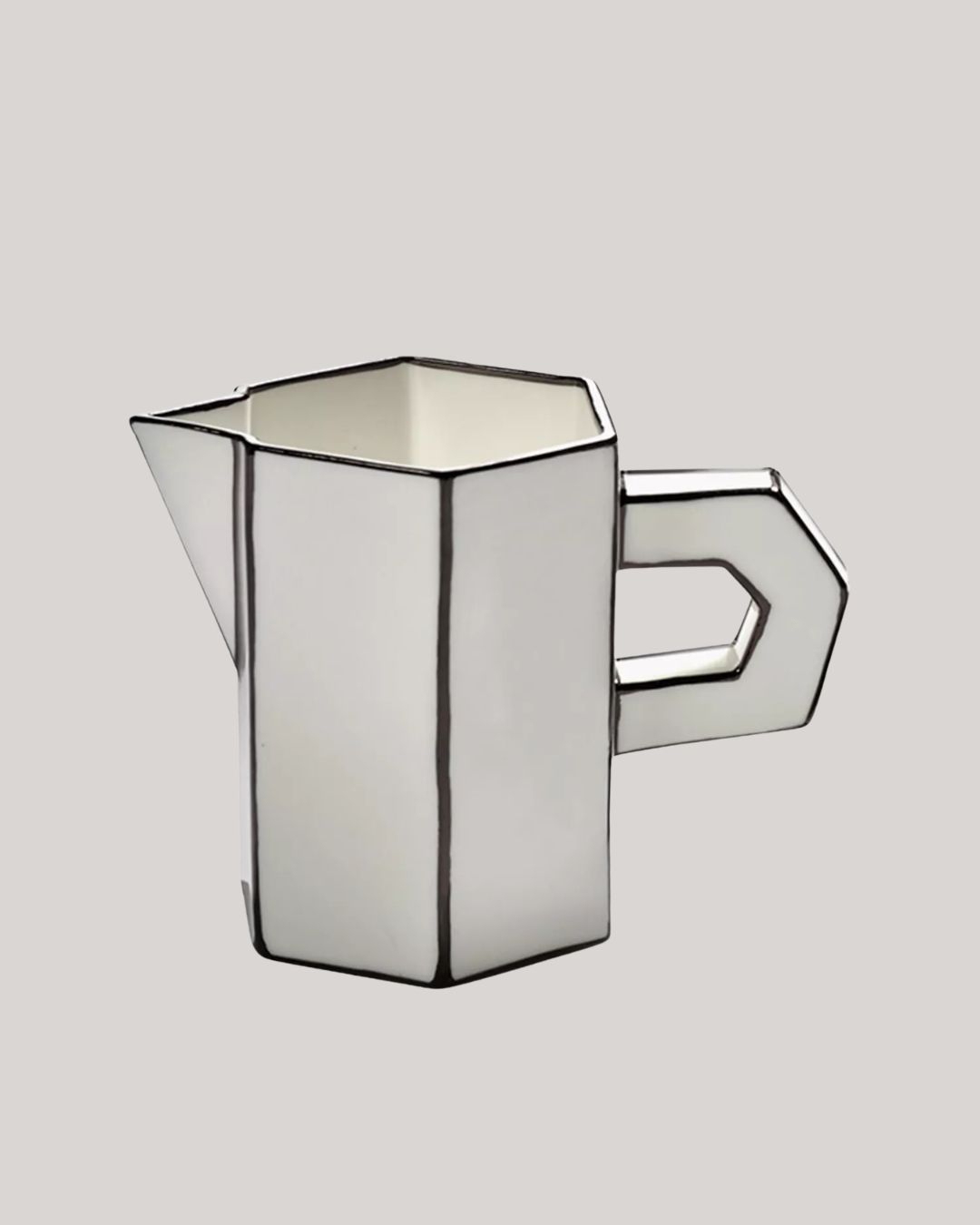Annebet Philips Carte Blanche Porcelain Jug against pale brown background.