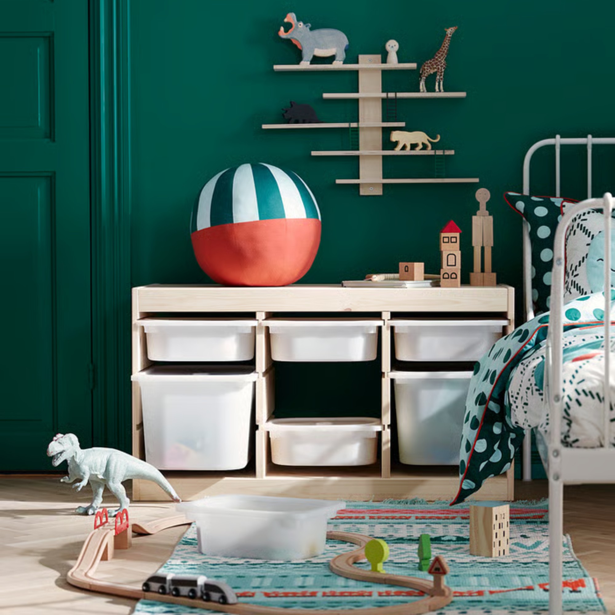 IKEA LUSTIGT wall shelf in a dark green-painted children's room