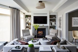 Living room ideas TV, open shelving either side and white walls
