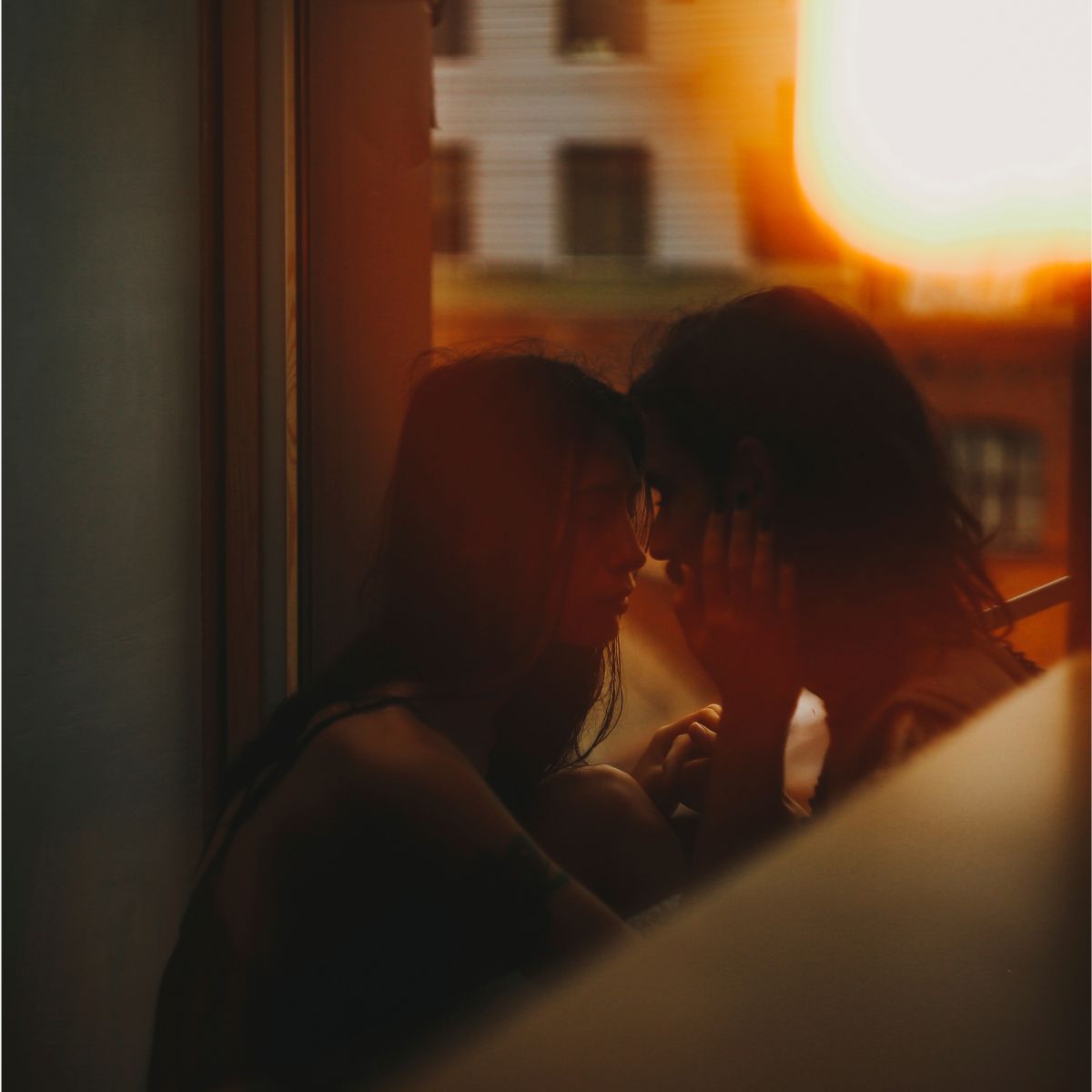 Caucasian woman caressing face of man - stock photo