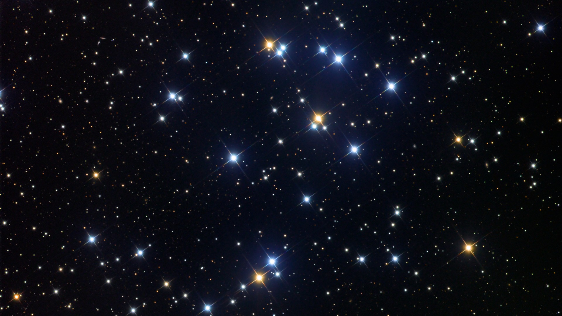 a dense, colorful grouping of stars on a black background
