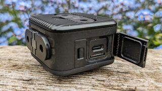 GoPro Hero 11 Black Mini on its side with flap open