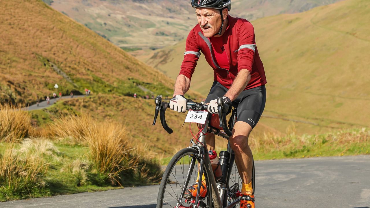 Richard Barrett riding up a steep climb