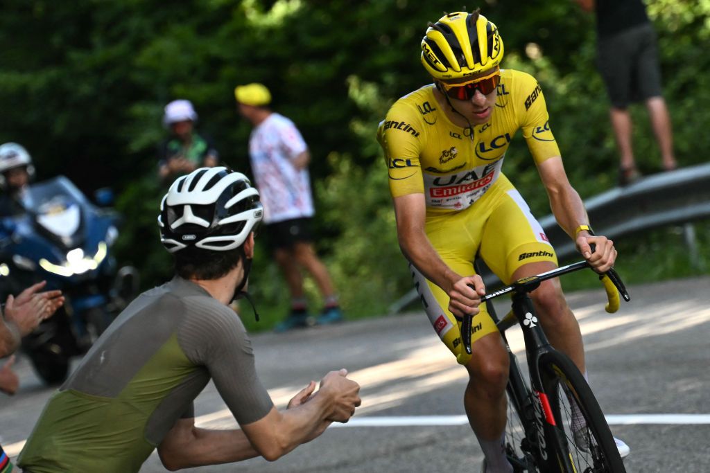 UAE Team Emirates team's Slovenian rider Tadej Pogacar wearing the overall leader's yellow jersey cycles in the final ascent of the Plateau de Beille during the 15th stage of the 111th edition of the Tour de France cycling race, 197,7 km between Loudenvielle and Plateau de Beille, in the Pyrenees mountains, southwestern France, on July 14, 2024. (Photo by Marco BERTORELLO / AFP)