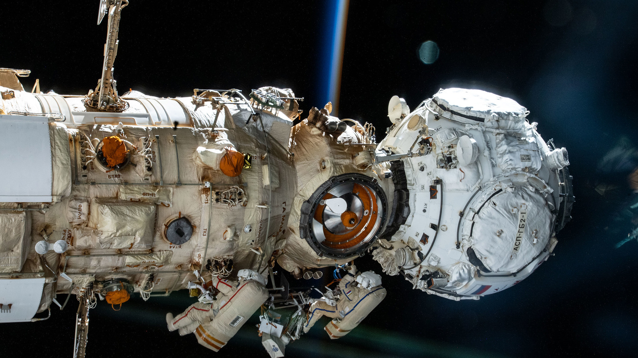 Roscosmos cosmonauts (from bottom left) Anton Shkaplerov and Pyotr Dubrov work outside the Nauka multipurpose laboratory module on the International Space Station during a spacewalk in January 2022.