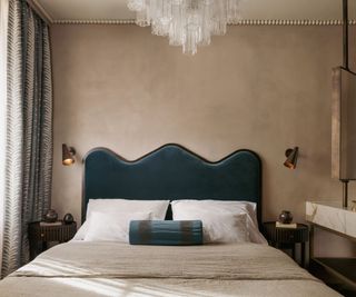 double bed with dark blue headboard