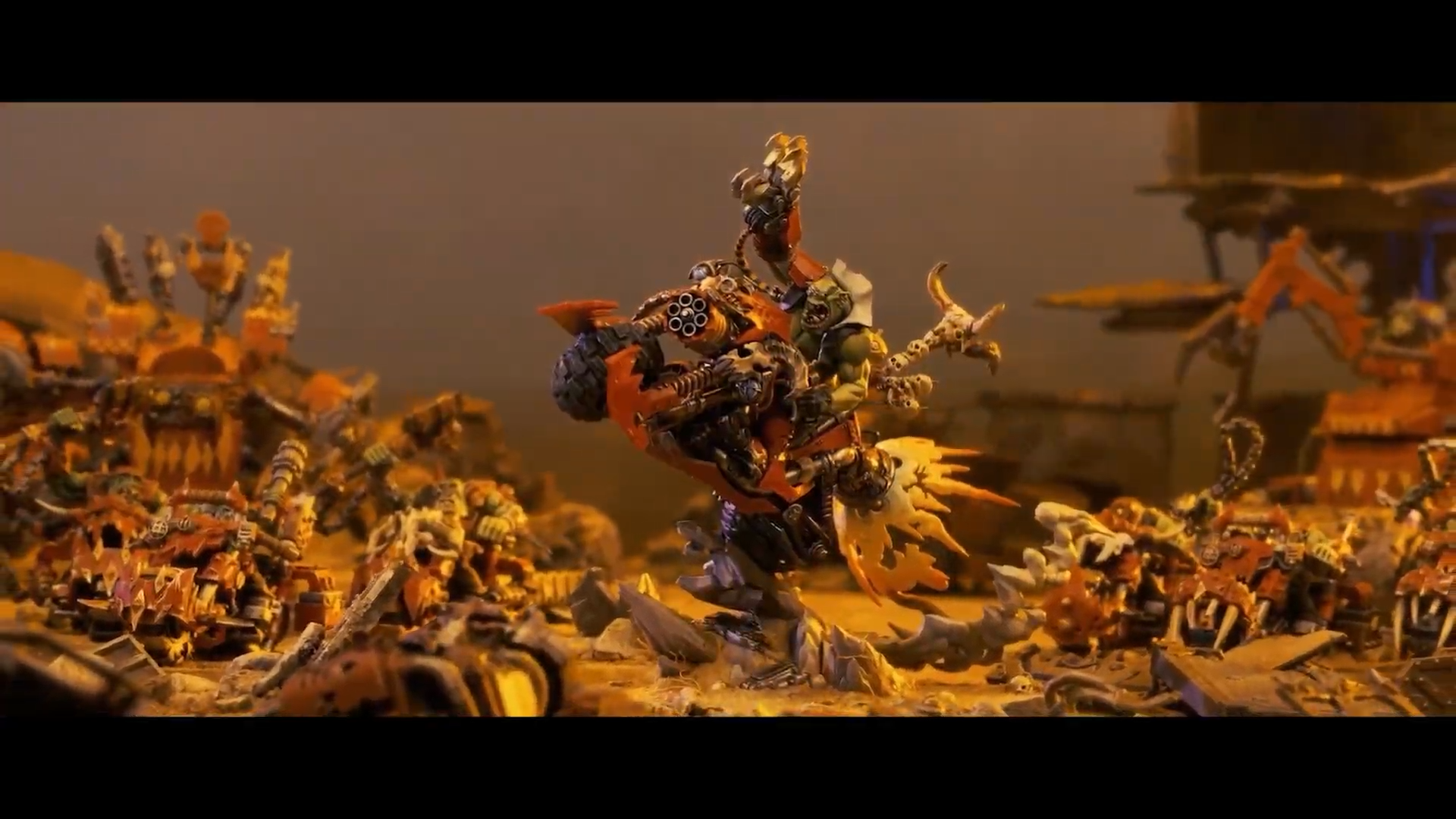 Warhammer miniatures posed against terrain and other models