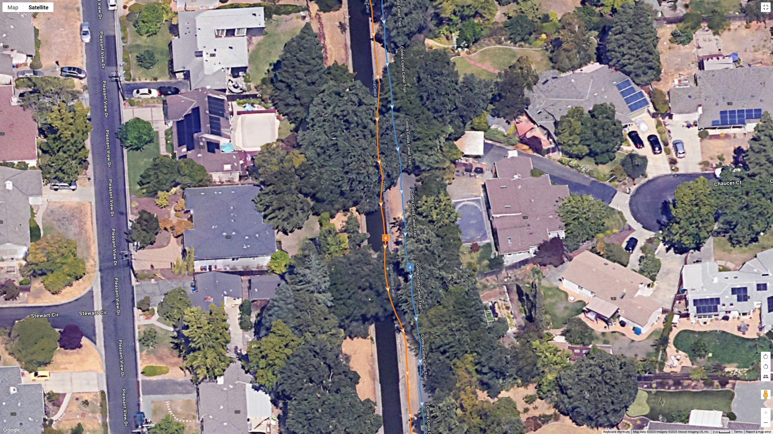 A Google satellite map showing how the Garmin Venu X1's all-systems GNSS line (orange) compares to the Garmin Forerunner 970's dual-frequency GPS line (blue) for accuracy during a city run.