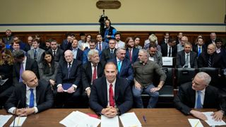 Ryan Graves, executive director of Americans for Safe Aerospace, David Grusch, former National Reconnaissance Officer Representative of Unidentified Anomalous Phenomena Task Force at the U.S. Department of Defense, and Retired Navy Commander David Fravor take their seats as they arrive for a House Oversight Committee hearing titled "Unidentified Anomalous Phenomena: Implications on National Security, Public Safety, and Government Transparency" on Capitol Hill 26, 2023 in Washington, D.C. Several witnesses are testifying about their experience with possible UFO encounters and discussion about a potential covert government program concerning debris from crashed, non-human origin spacecraft.