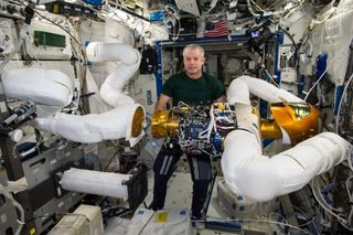 NASA's Robonaut 2, seen here getting its legs in space in 2010, will return to Earth for repairs on SpaceX's Dragon.