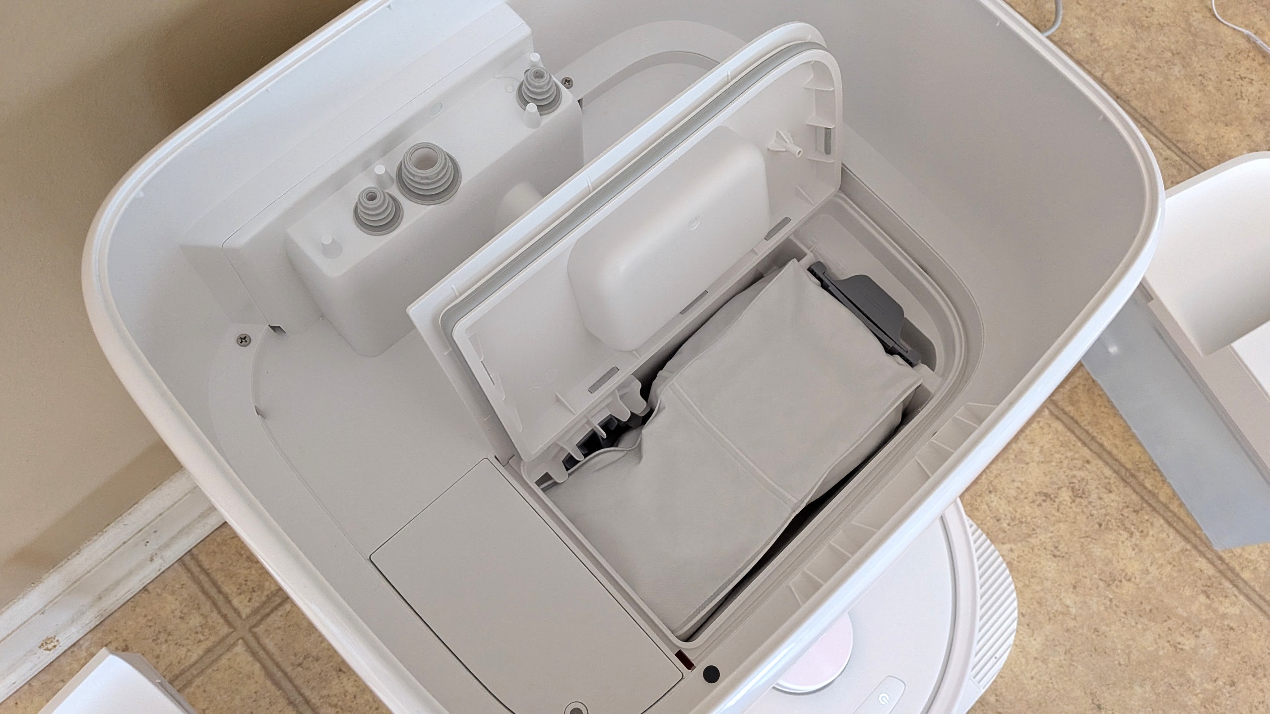 Roborock Qrevo 2 Pro dock open, showing dust bag
