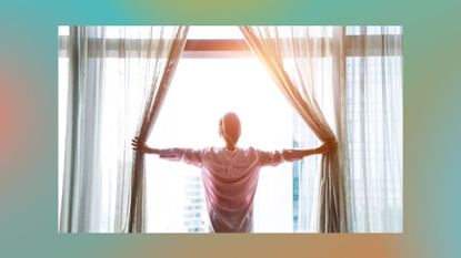 woman opening curtains with the sunlight streaming in, against a green and orange background