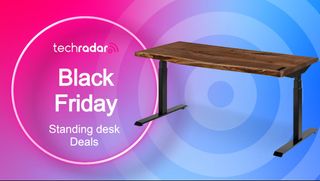 Black Friday text next to a standing desk in a lowered position