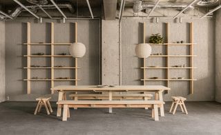 minimalist retail space with pale wood furniture and shelves