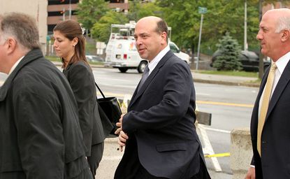 Samuel Israel III, center, arrives at U.S. District Court in UNITED STATES