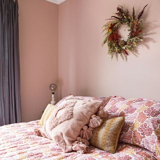 pink bedroom with floral bedlinen