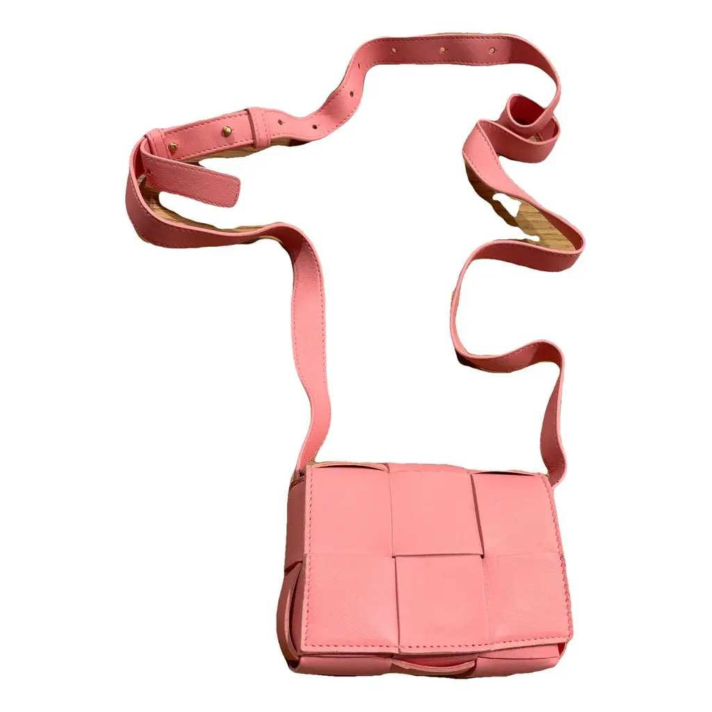 a pink bottega veneta cassette bag