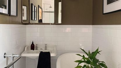 bathroom with bathtub mirror on wall with wash basin 