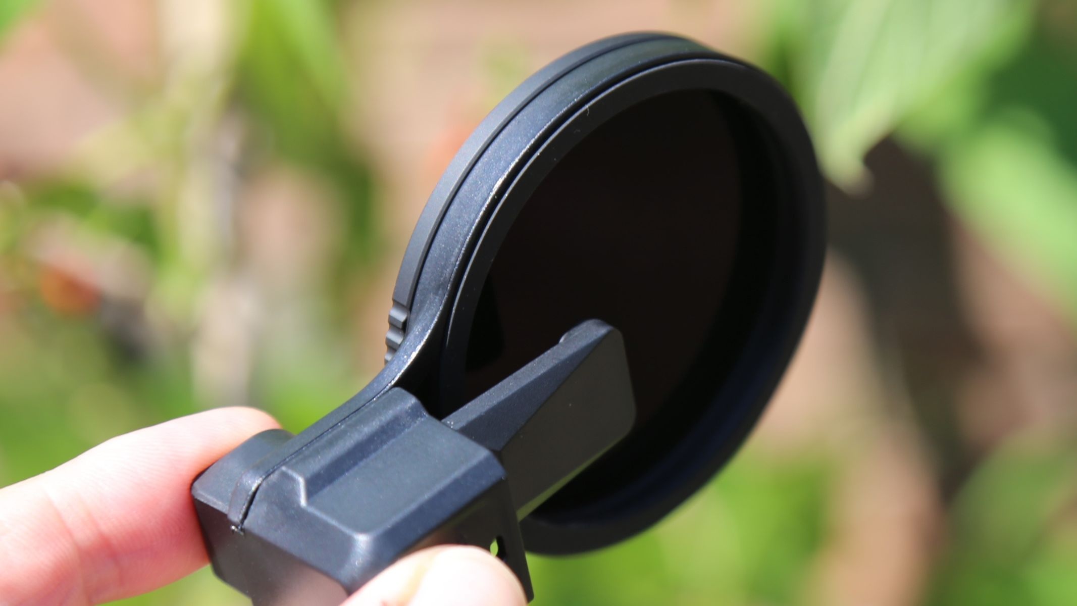 The 67mm glass filter cuts light by 20 stops
