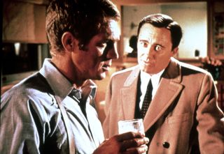 Steve McQueen is suspicious of Robert Vaughn