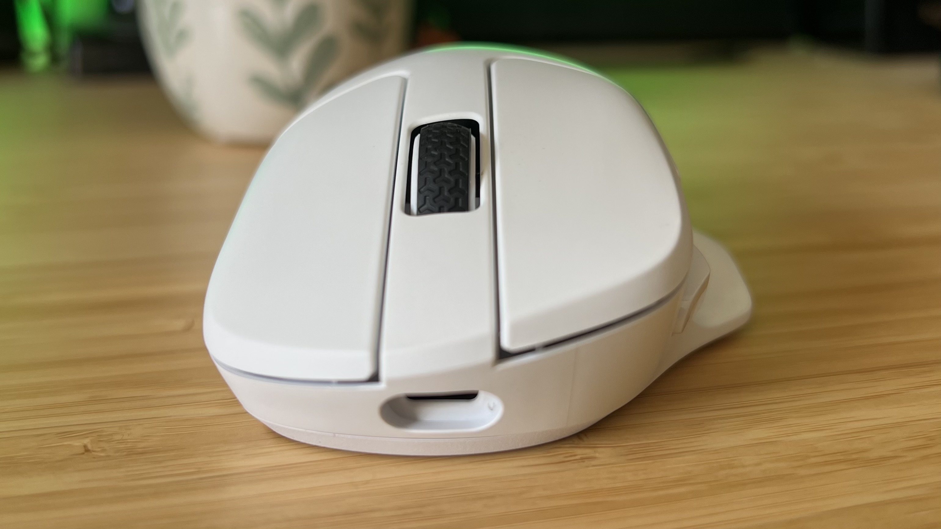 Front of Keychron M7 8K showing USB-C port on a wooden desk