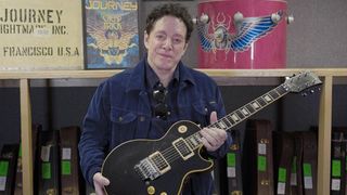 Neal Schon holding his 1977 Gibson Les Paul Deluxe