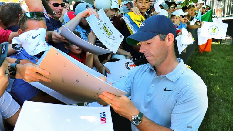 Rory McIlroy signing autographs