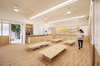 school classroom with low tables with storage