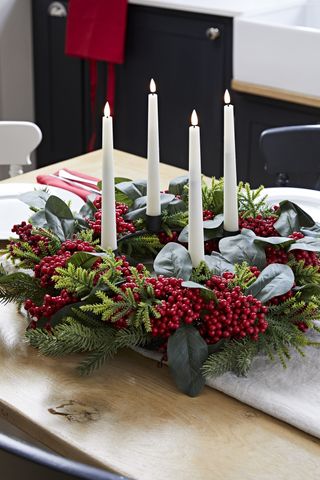 Christmas table wreath with four Truglow candlesticks