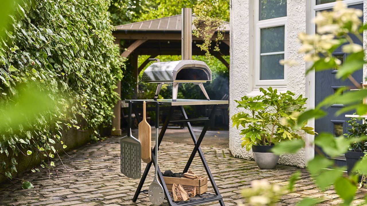 Ooni pizza oven on folding table.