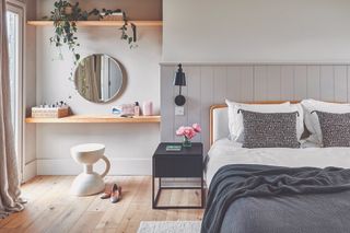 The bedroom suite with a built-in vanity and headboard panelling