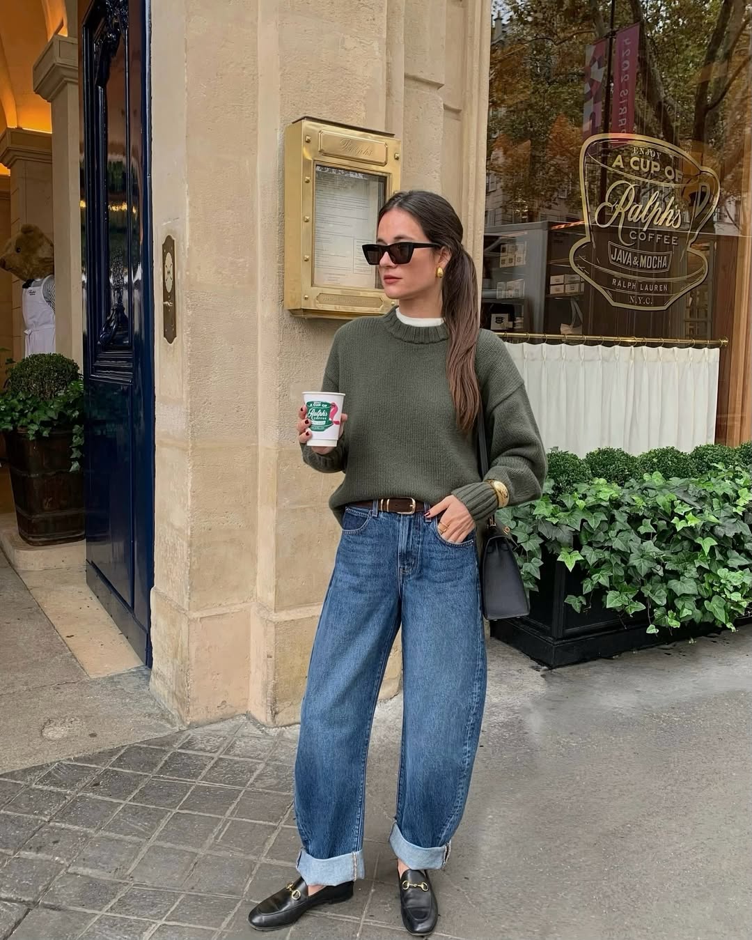Julie in a green jumper and jeans