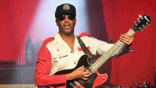 Tom Morello performing onstage in 2017