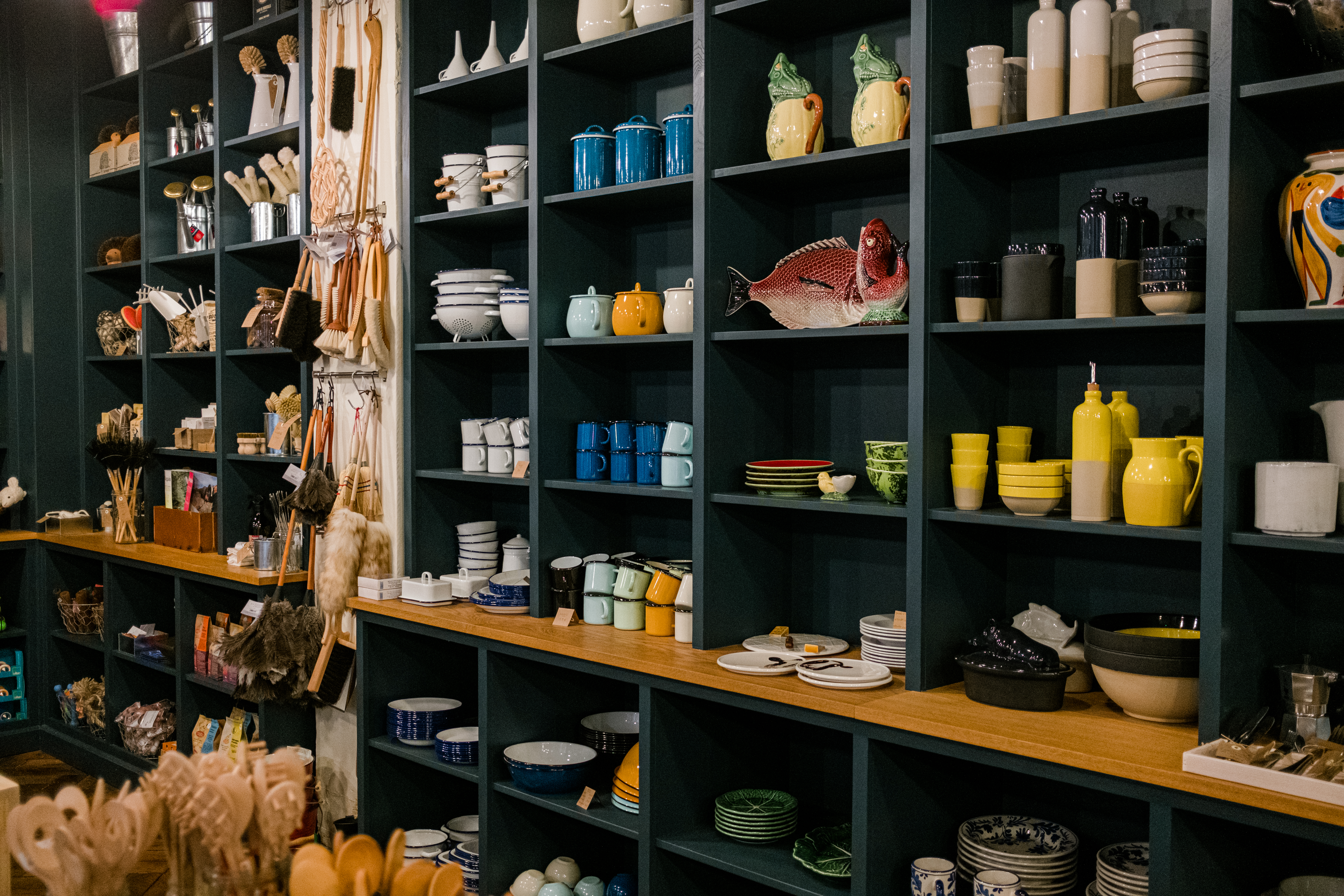 shelves in the landline paris general store shop with colorful kitchen items on