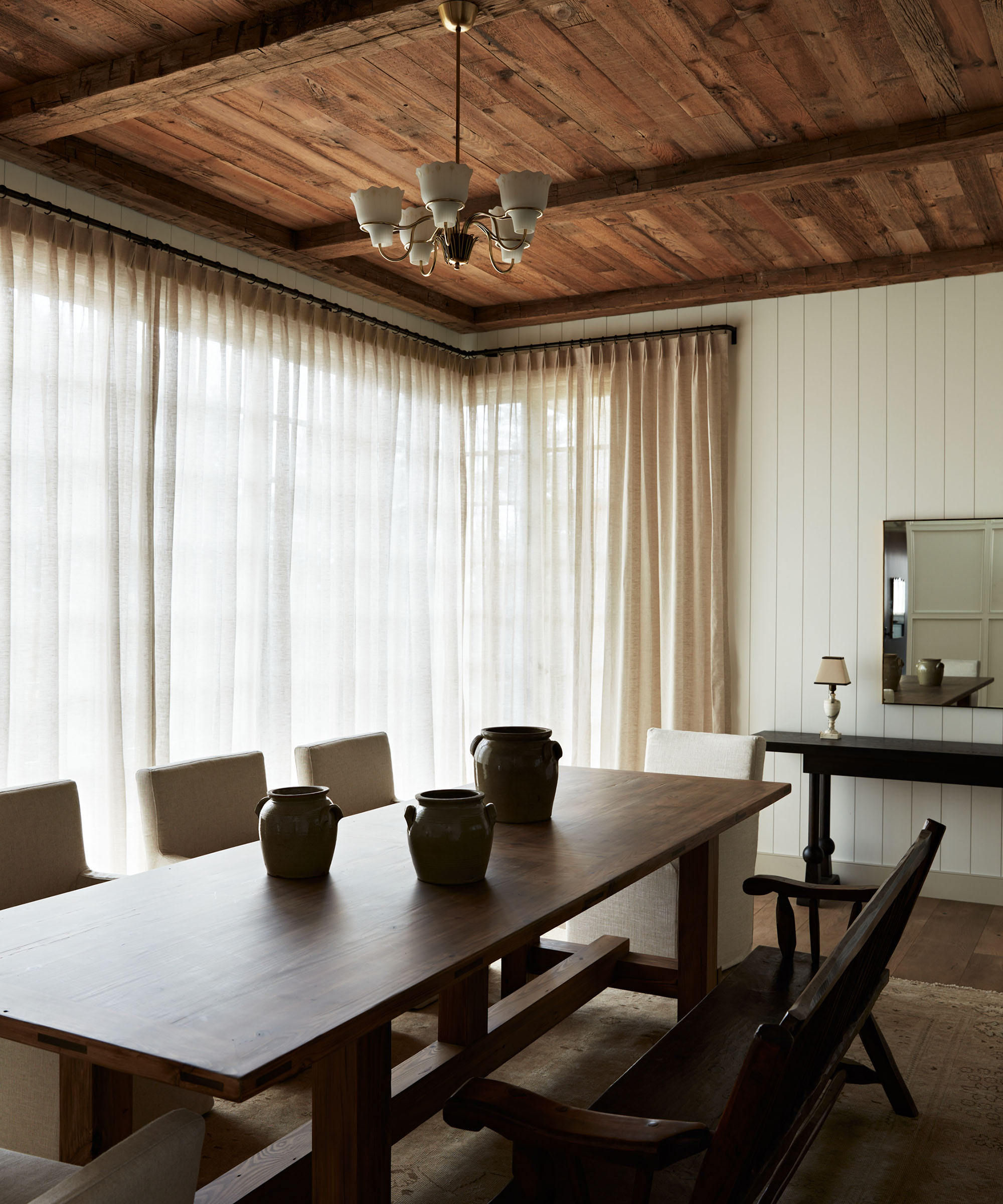 dining table next to light sheer drapes