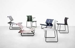 A series of chairs whose seat and back are made by a continuous, folded metal sheet, in pink, grey, white, green and blue