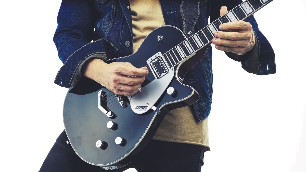 Guitarist playing a Gretsch guitar