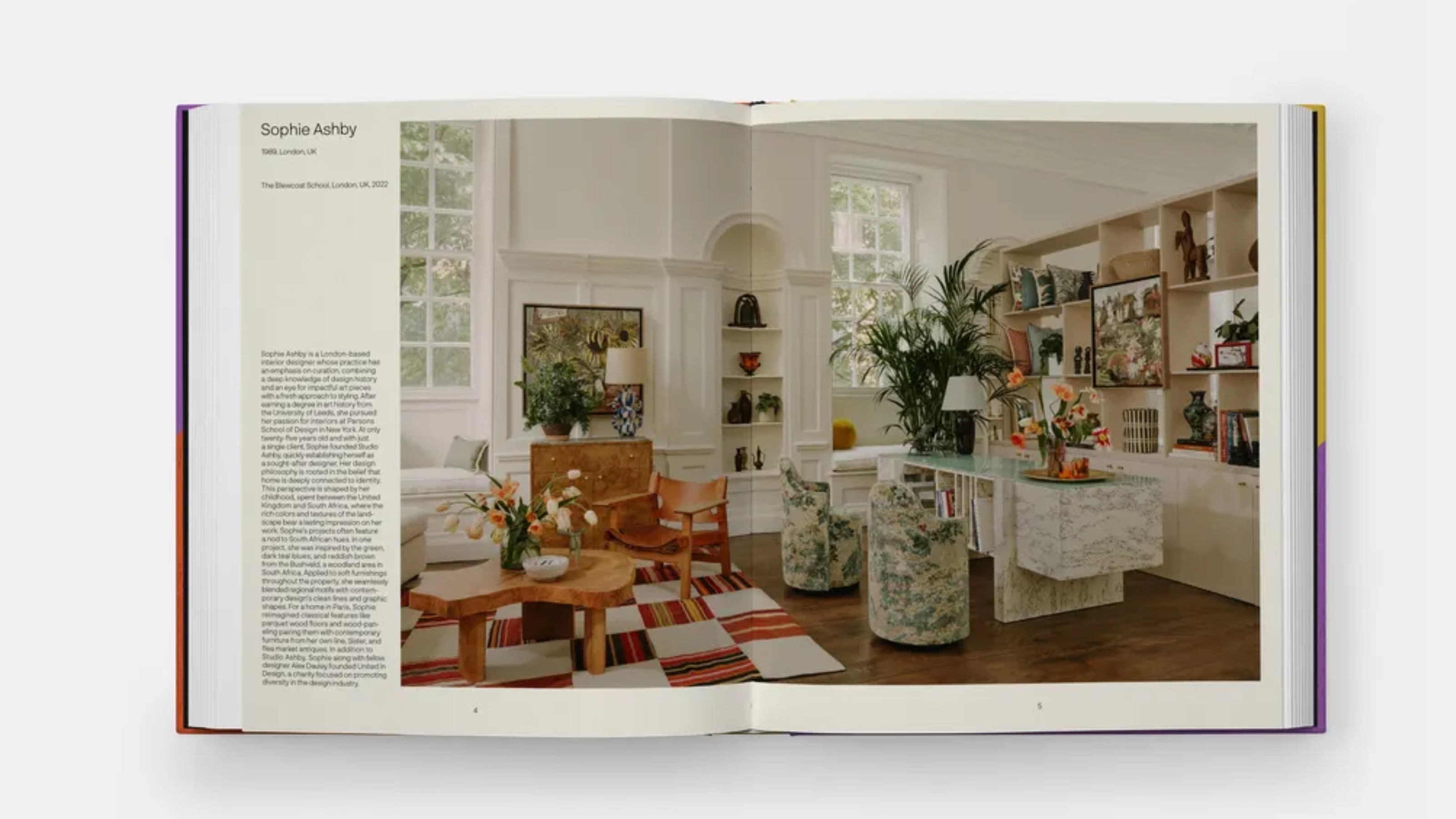 an open book showing a photo of interior design